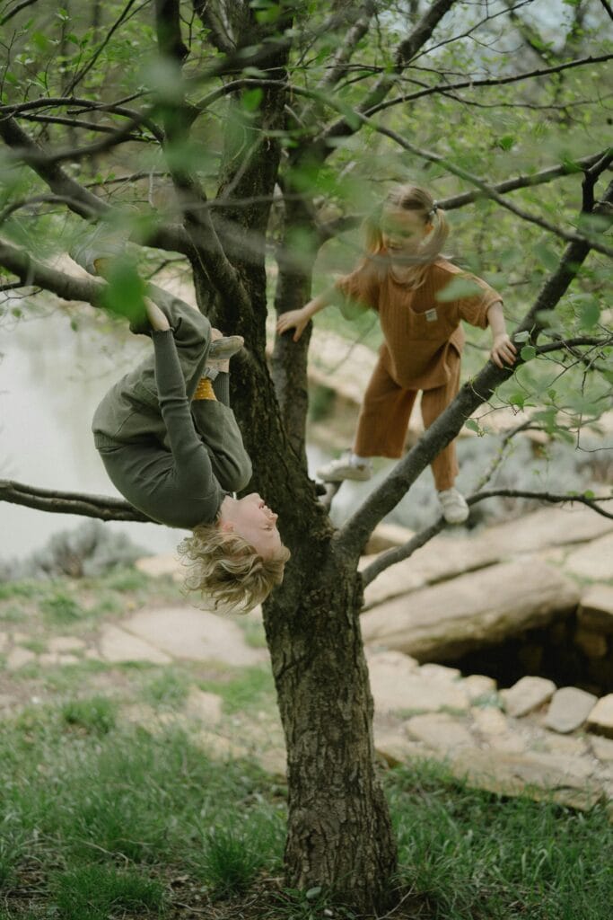 Your Child's Natural Way Of Learning (It's Not What Traditional Schools Do) 15 Two kids climbing a tree together