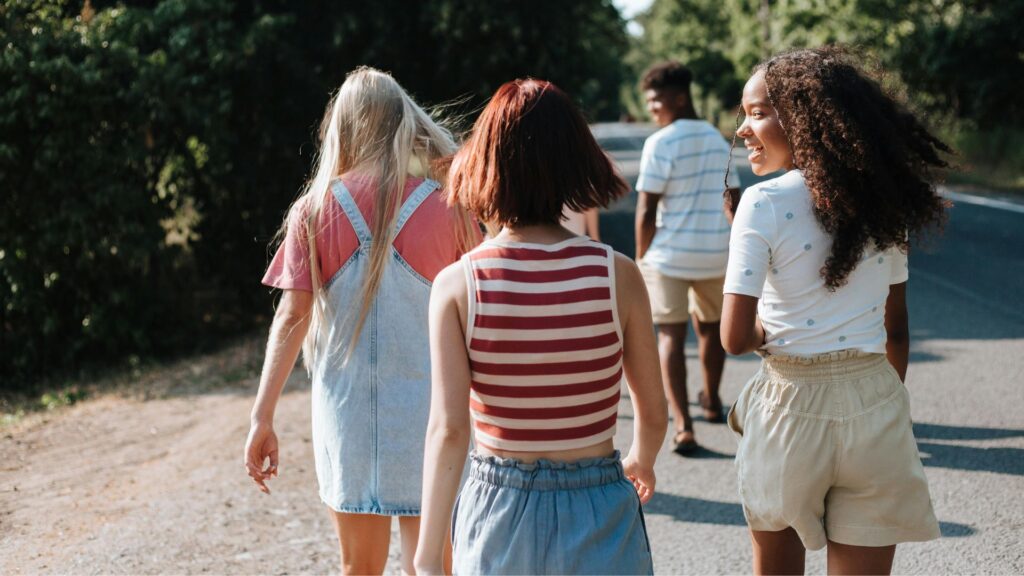 Montessori, Waldorf, or Something Different? A Parent's Guide to Educational Choices 6 Four young women walking down a road.