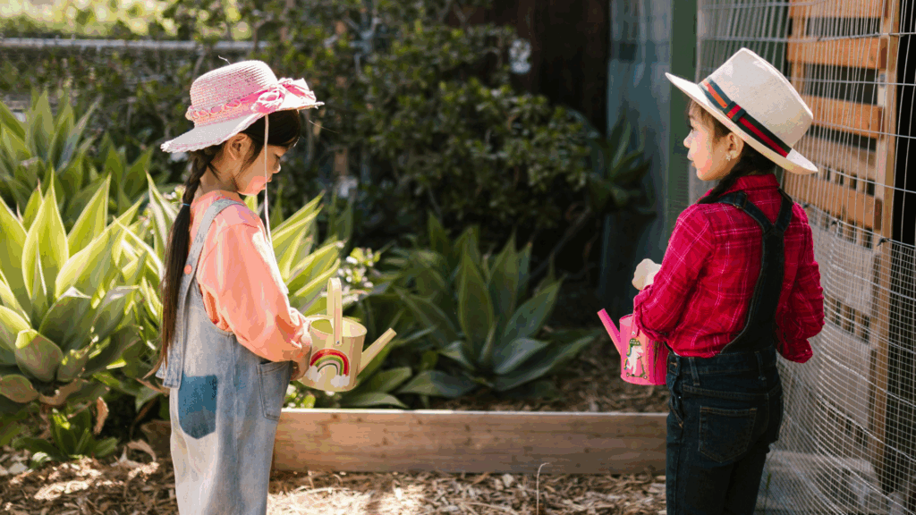 4 Traditional Schooling Alternatives: Homeschooling, Unschooling, Online Schooling, or something better? A Parent’s Guide. 5 Schola Vera Community: Two children learning together outside.